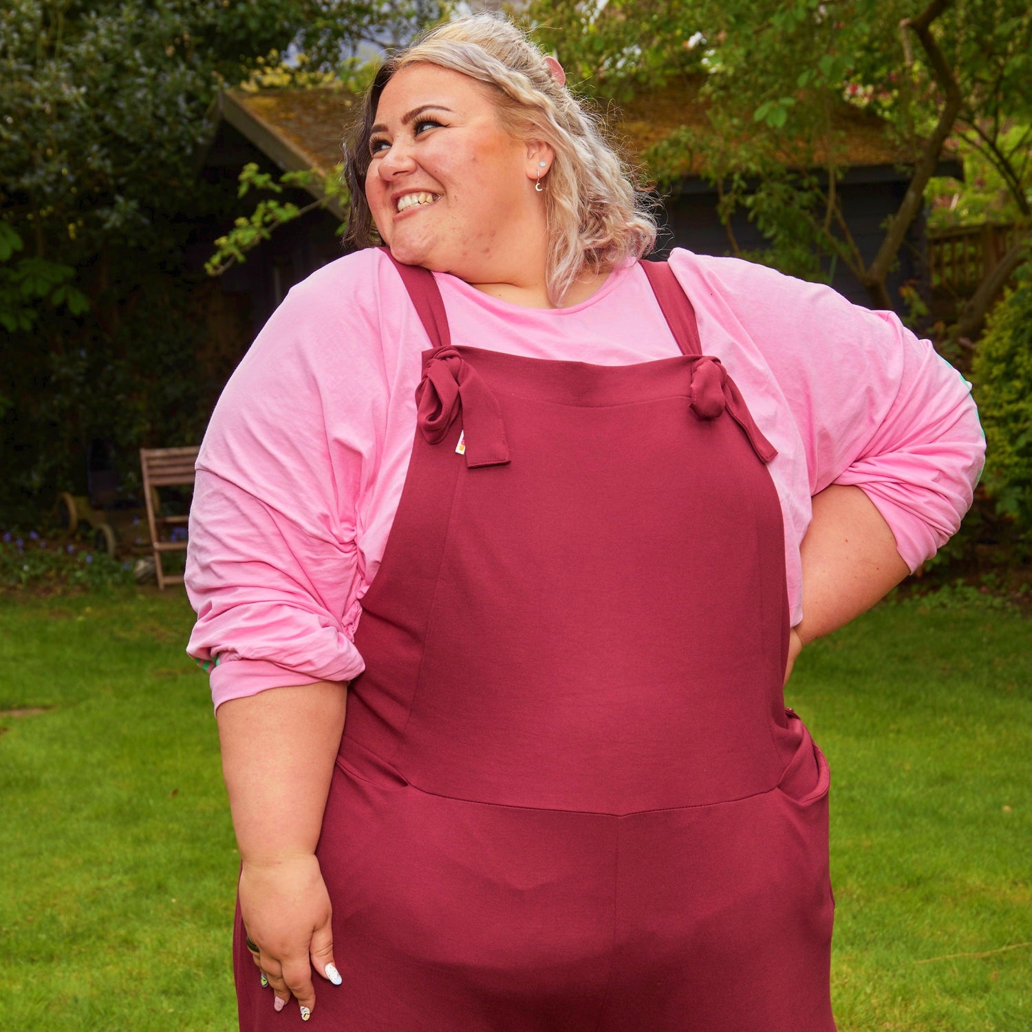 Woman wearing burgundy dungarees