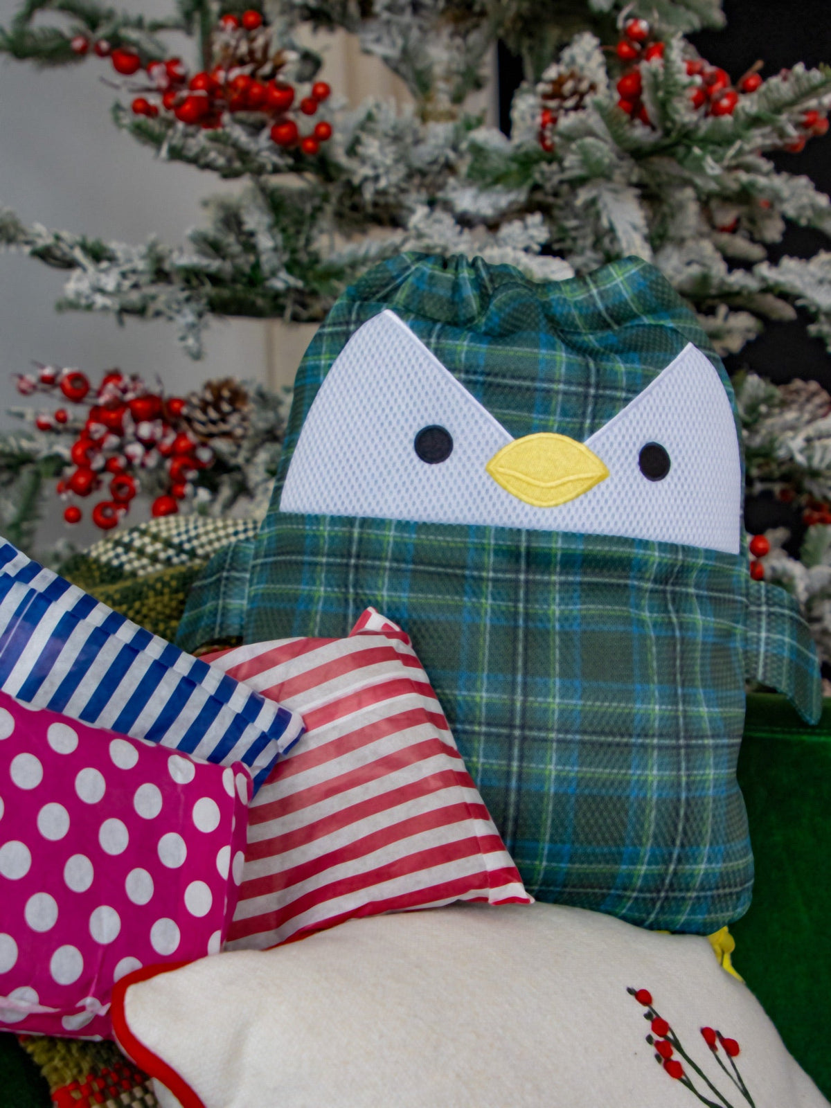 Scotch the tartan penguin washbag surrounded by wrapped mystery parcels