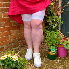 Woman wearing white chub rub shorts 