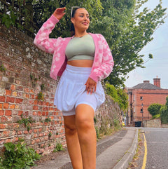 Woman wearing white chub rub shorts